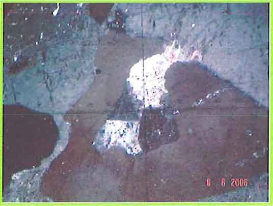 K-Feldspar Showing Rare Sector Twin And Intergrowth With Quartz photomicrogaph image